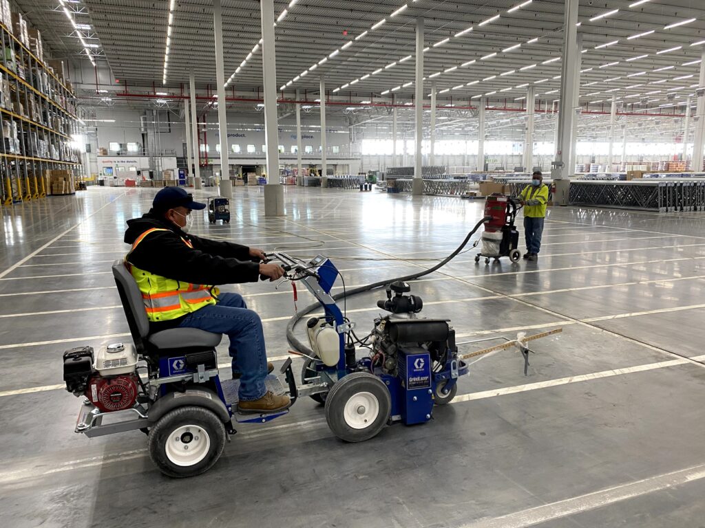 Resurfaced warehouse floor with fresh highcontrast safety striping