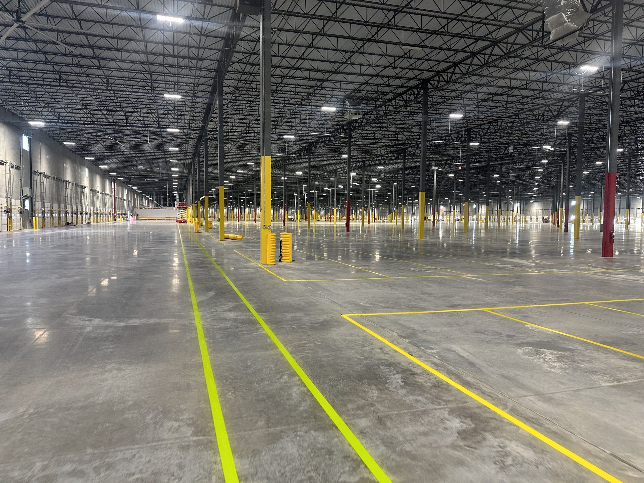 Industrial warehouse floor markings installed in Michigan for a manufacturing facility using durable epoxy striping