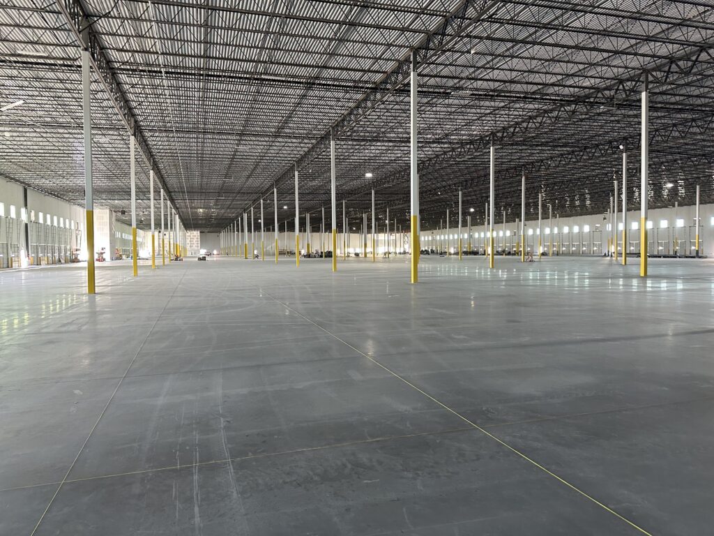Warehouse epoxy line striping completed in Kansas distribution center with OSHAcompliant safety walkways and forklift lanes