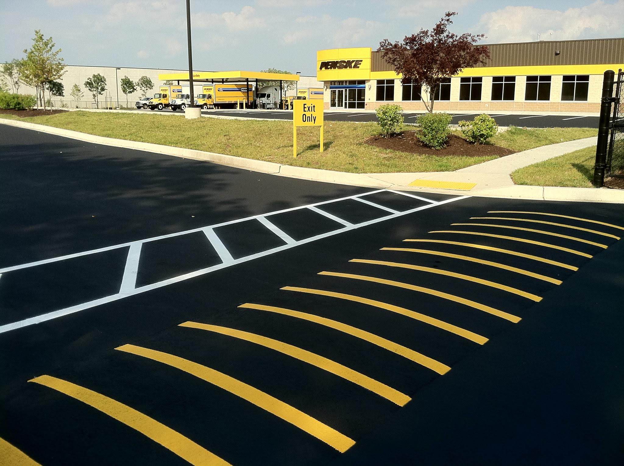 Commercial parking lot striping near me with ADA-compliant parking spaces, fire lane striping, and custom pavement markings.