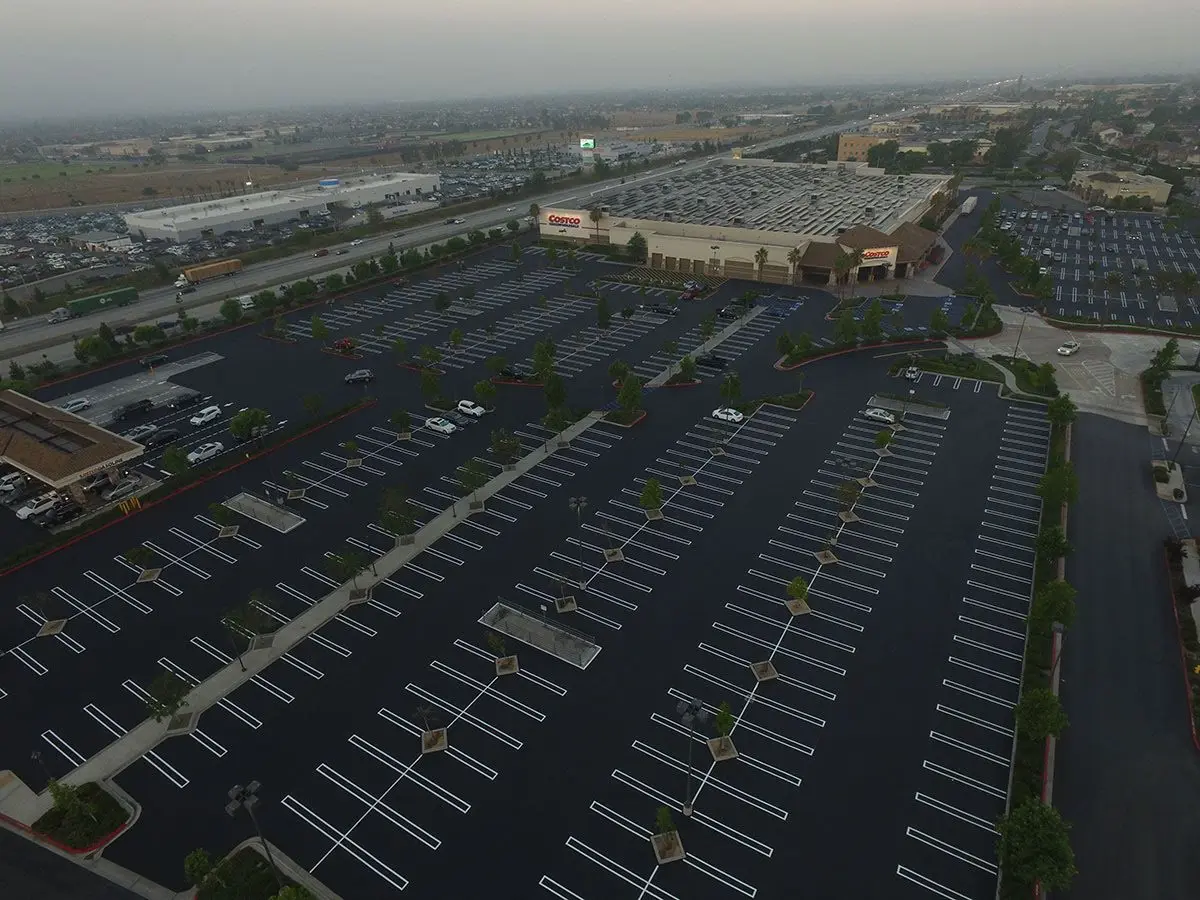 Aerial view of a commercial parking lot with clearly marked parking spaces