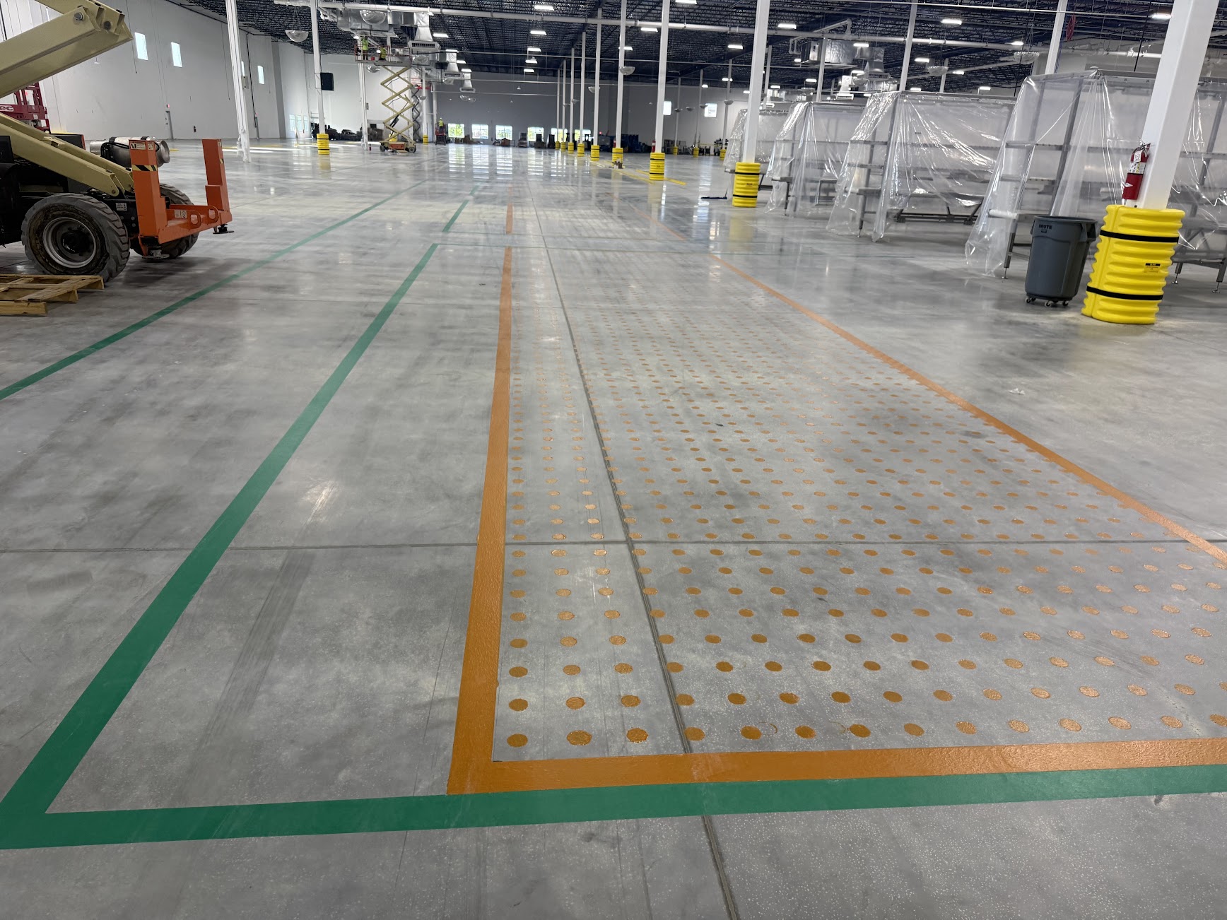 Industrial warehouse floor with designated safety marking zones
