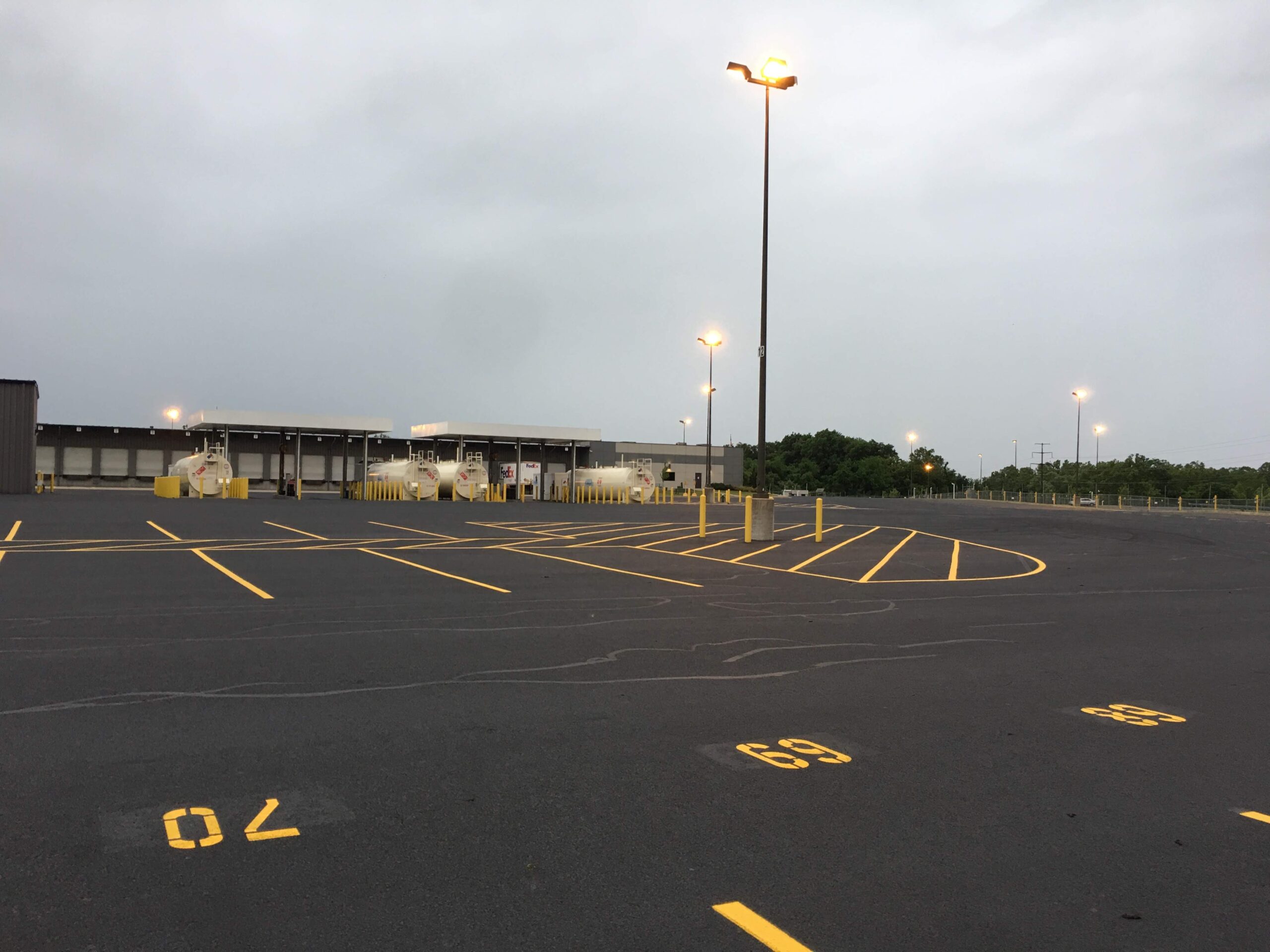 Yellow traffic markings in an industrial yard