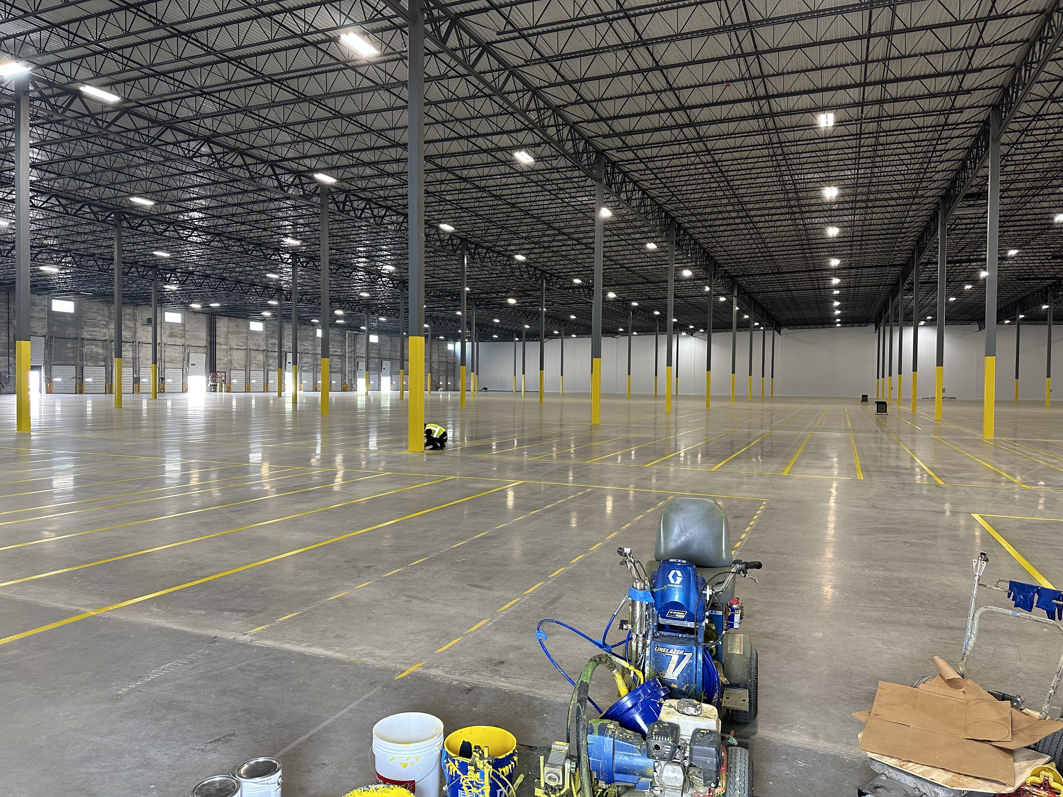 Completed industrial floor marking project inside a warehouse