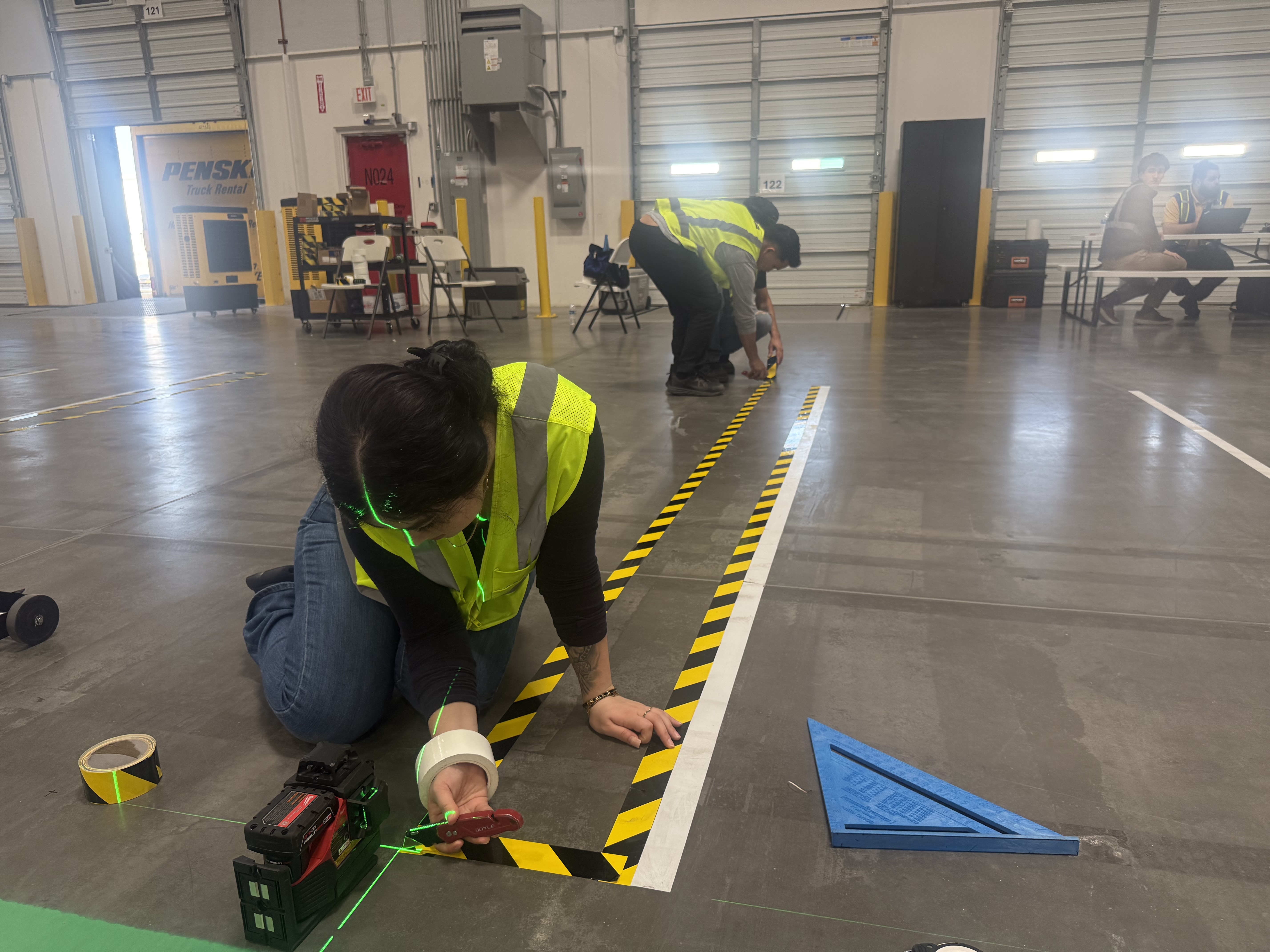 Yellow industrial warehouse floor marking tape rolls ready for installation