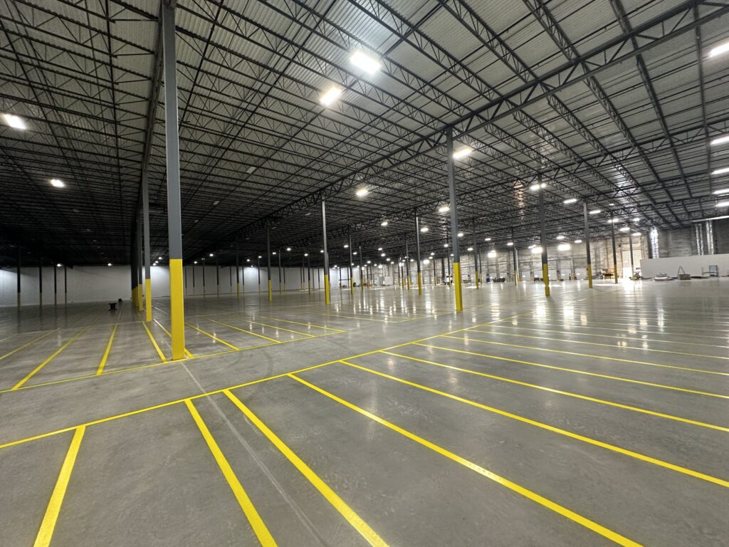 Industrial warehouse floor striping and yellow epoxy markings