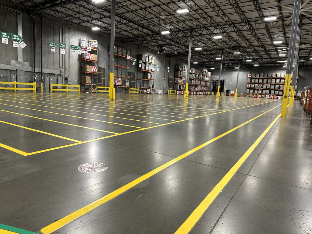 Industrial warehouse floor striping and yellow epoxy markings