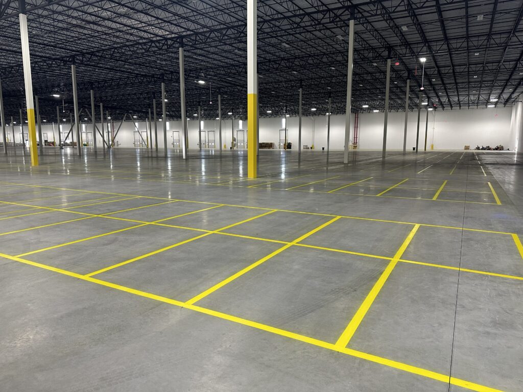 Industrial warehouse floor striping and yellow epoxy markings